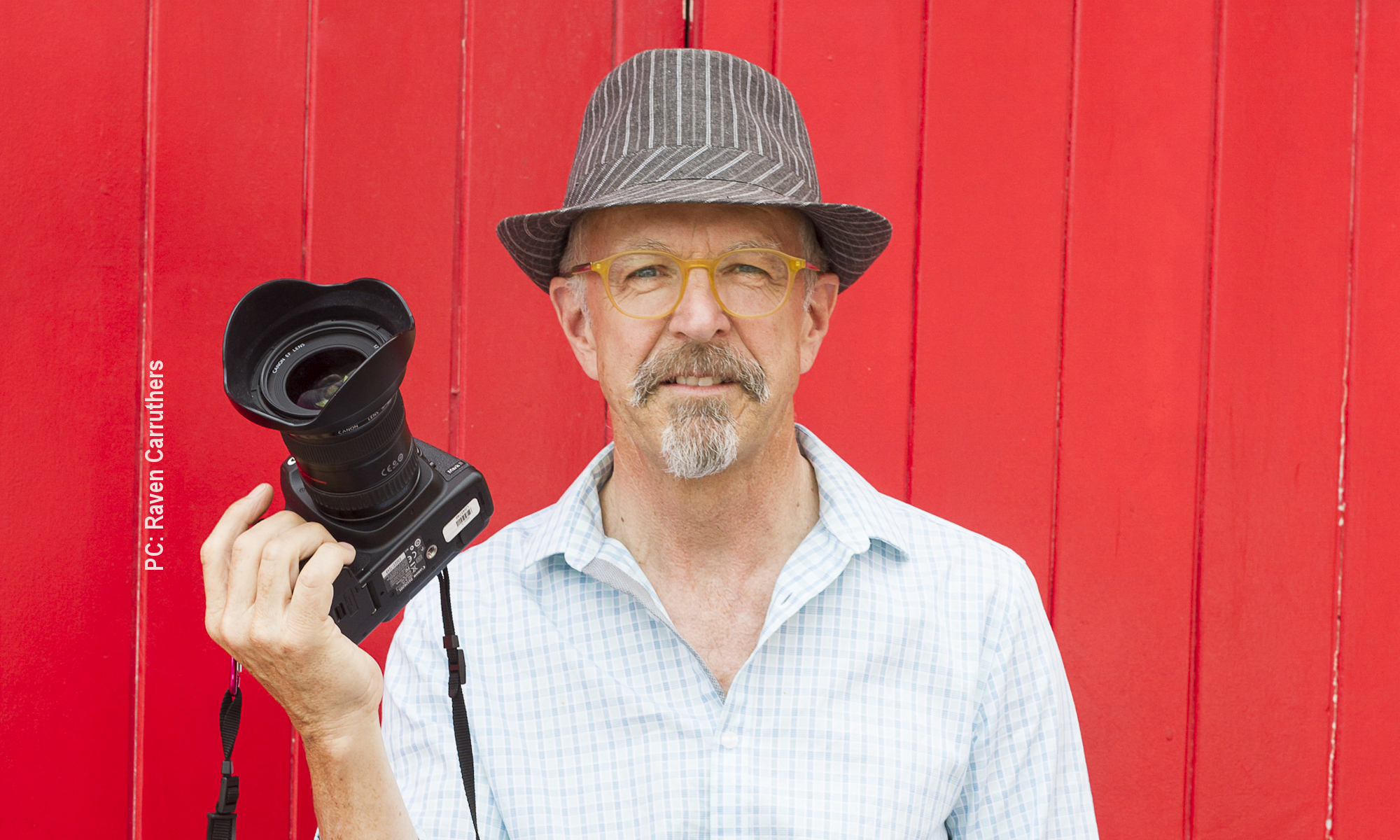 Photographer Dave Kempton holding his Canon 5D