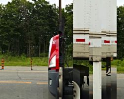 Photo made with panorama from a moving car while passing a truck